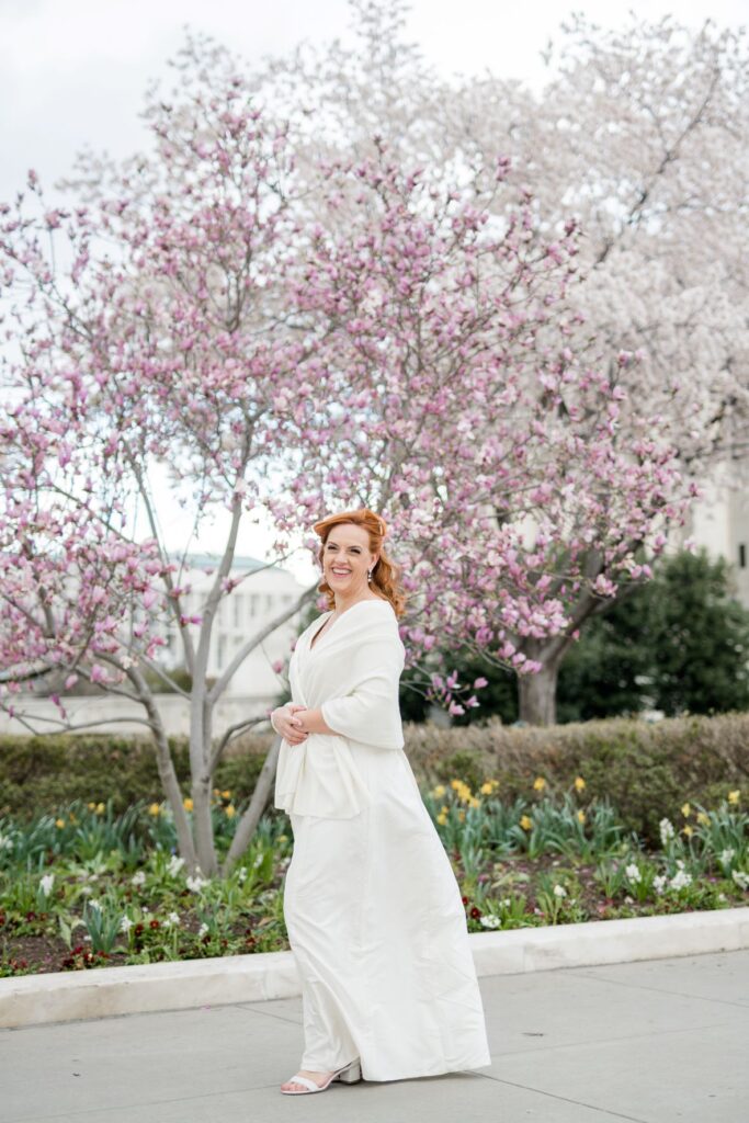 Bride smiling with spring flowers in the background