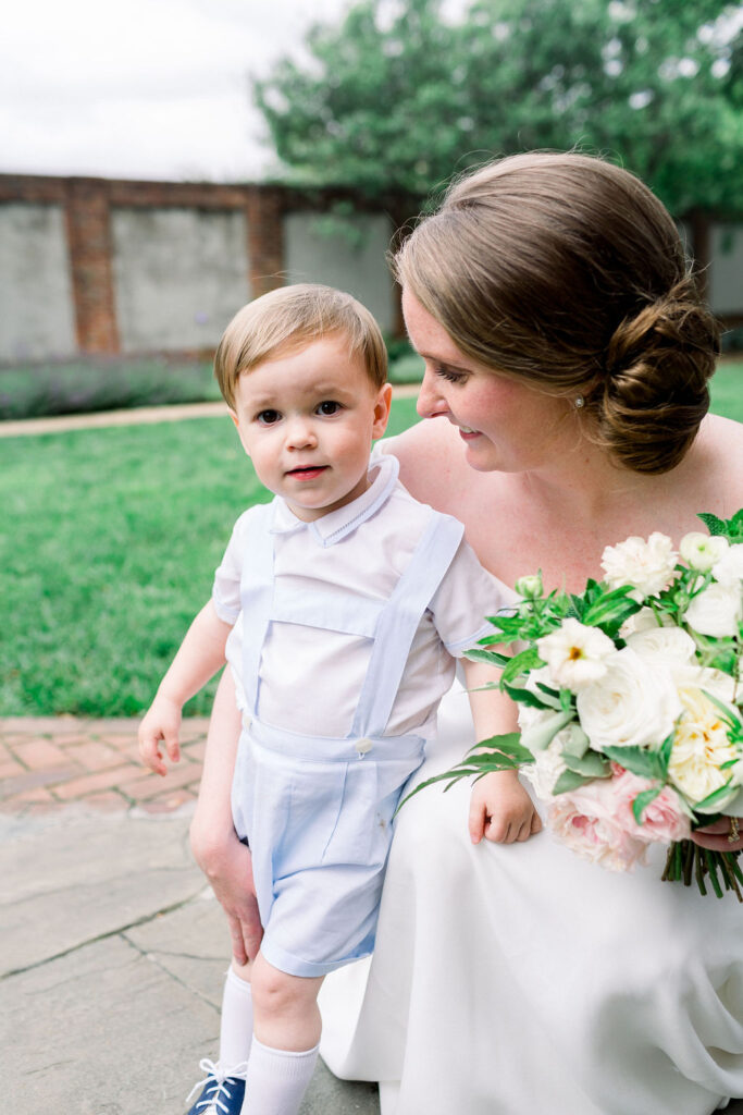 Bride looking at son who is looking at the camera