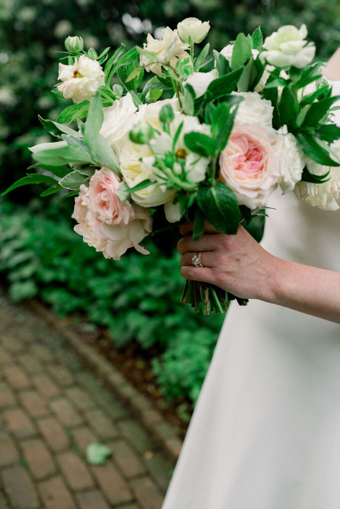 Bride's bouquet of white and pink flowers with greenery